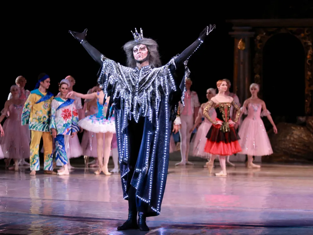 Characters from the Nutcracker performing.
