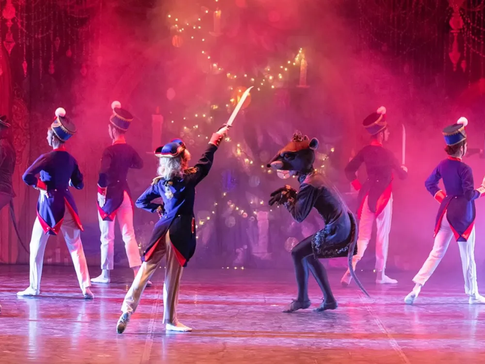 Characters from the Nutcracker performing.
