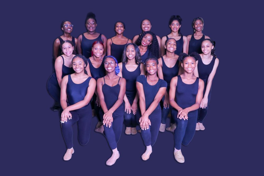 Group photo of the Junior and Senior Ensemble of Black Girls Dance, dressed in their sleek dance uniforms, exuding professionalism and youthful talent. 