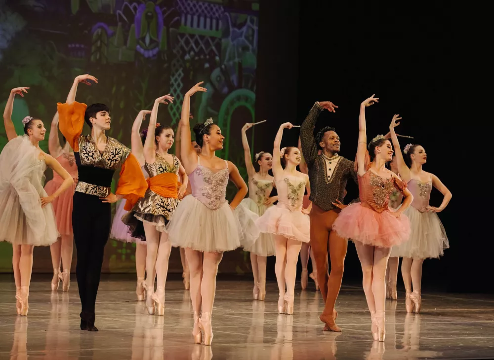 Ballet Chicago Dancers in dazzling tutus grace the stage, showcasing the Sugar Plum Fairy and Cavalier in a magical Nutcracker performance.