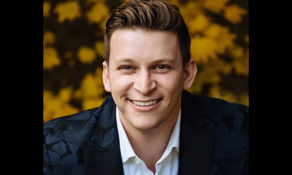 Headshot of Aryeh Nussbaum Cohen. A man smiling.