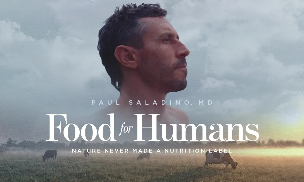 Image for the documentary Food for Humans. It shows Paul Saladino, MD, in side profile against a cloudy sky, with a pasture of cows below him. The film’s title and tagline appear over the image: “Food for Humans — Nature Never Made a Nutrition Label.”