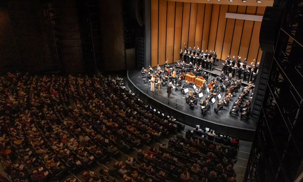 MOB Chorus and Orchestra on the stage at the Harris Theater