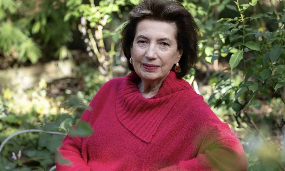 Dame Imogen Cooper in a red sweater