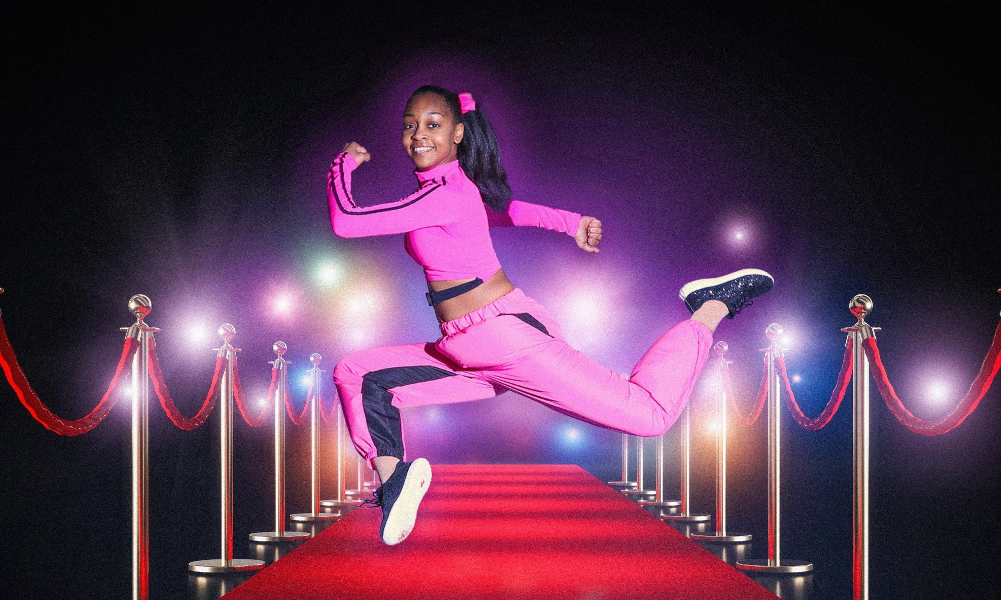 Image of an elegant dancer gracefully positioned on a luxurious red carpet, illuminated by radiant spotlights from above.