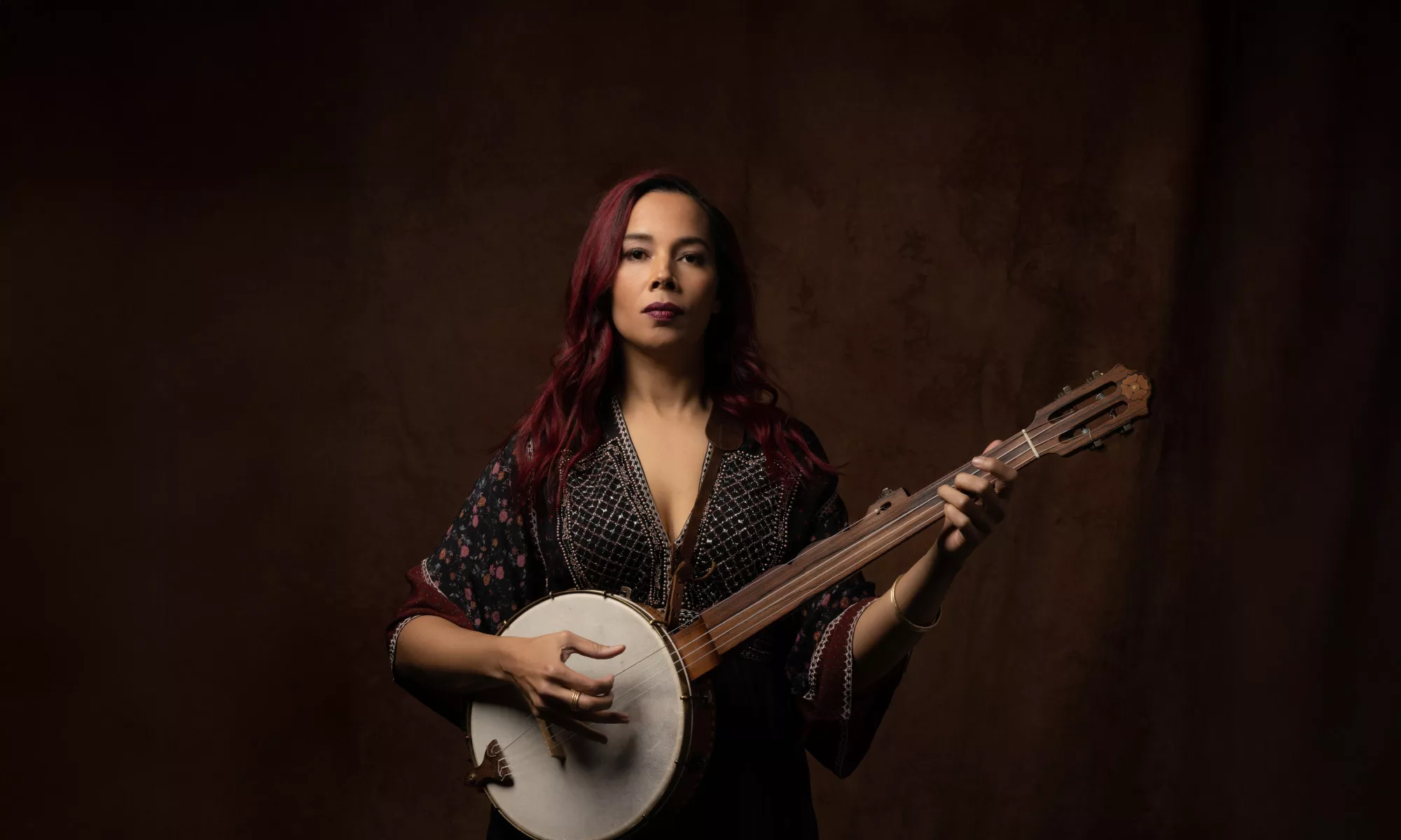 Rhiannon Giddens holding a Bango. 