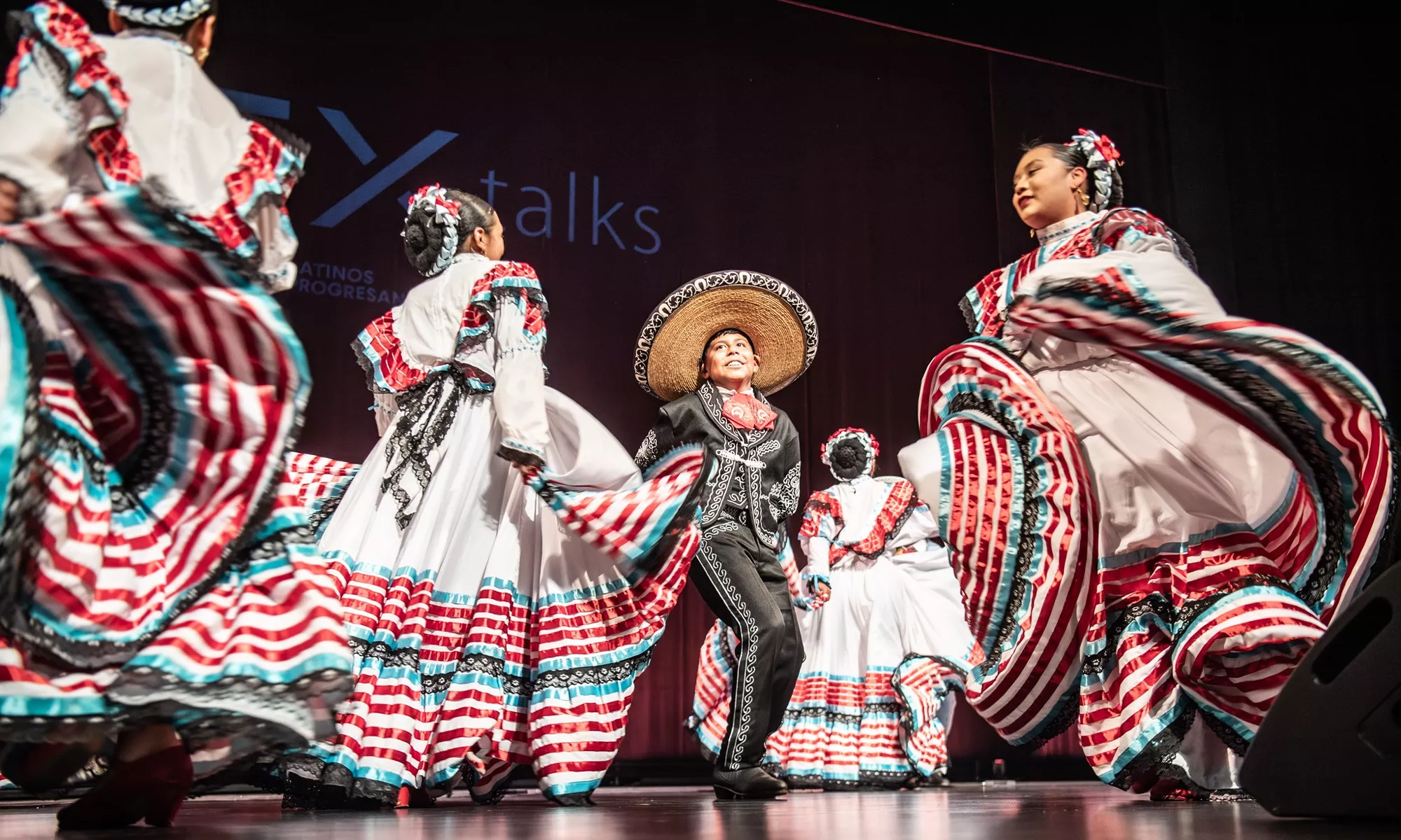 Young dancers performing a Mexican folkloric dance.