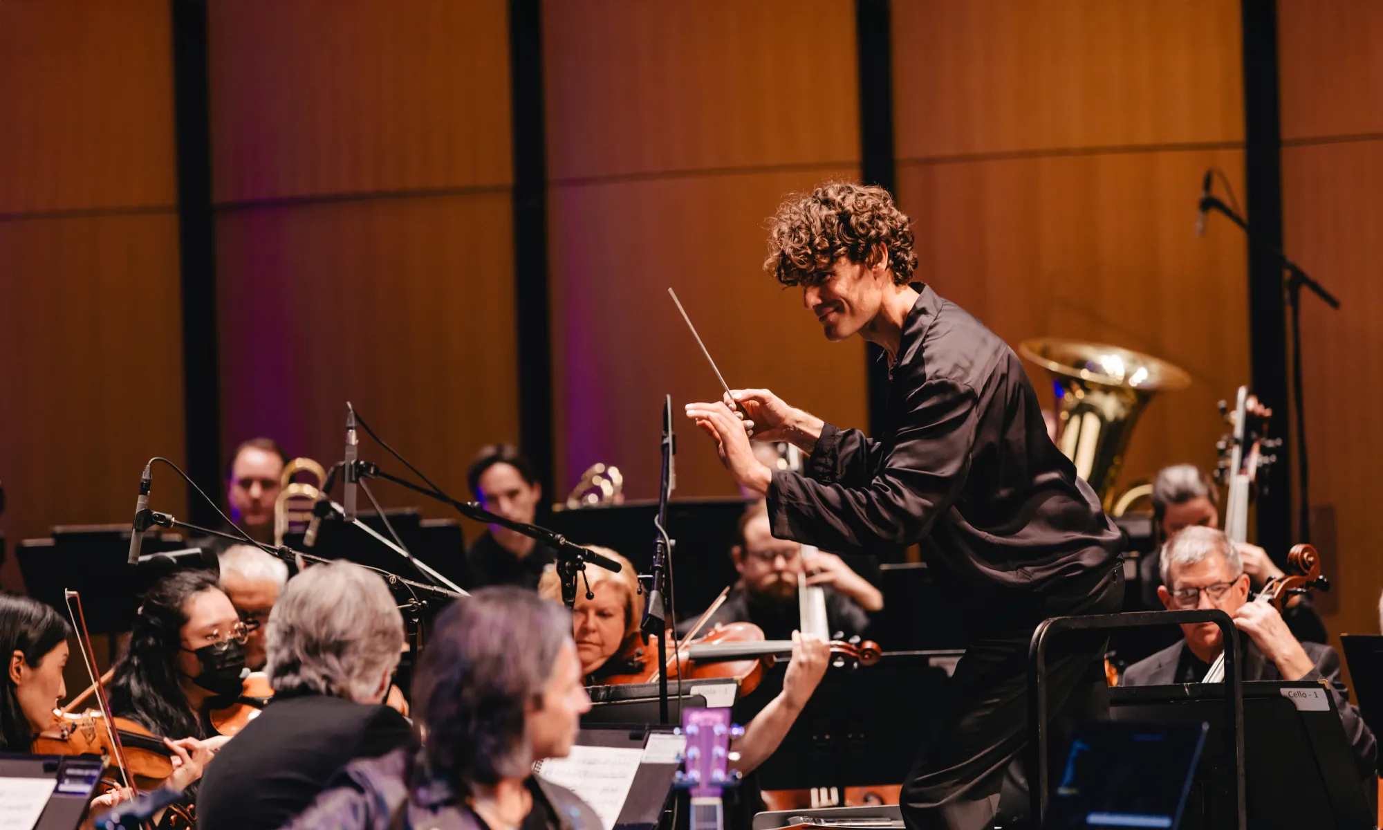 Steve Hackman conducting an orchestra.