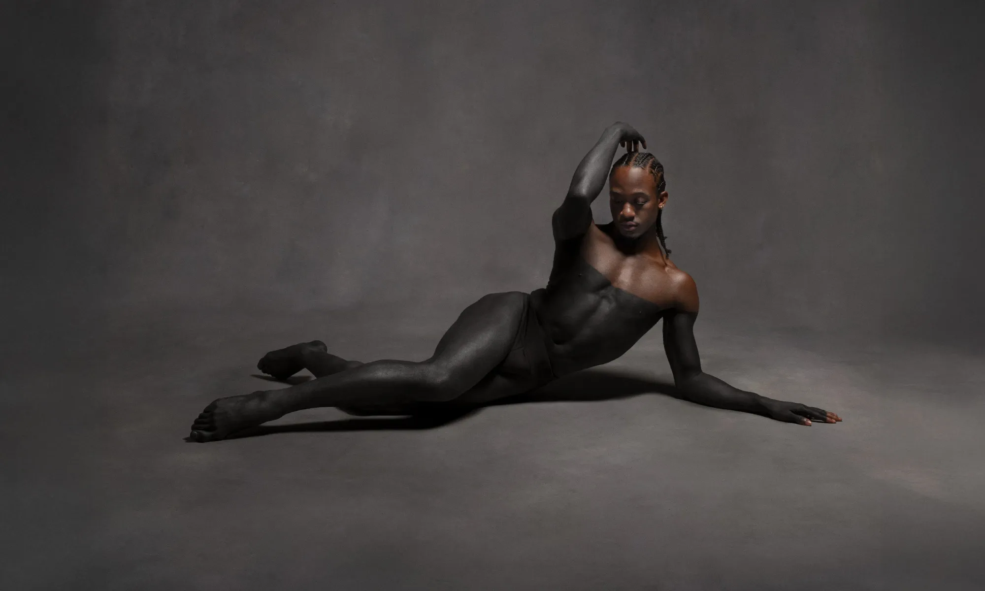 A dancer laying on the floor