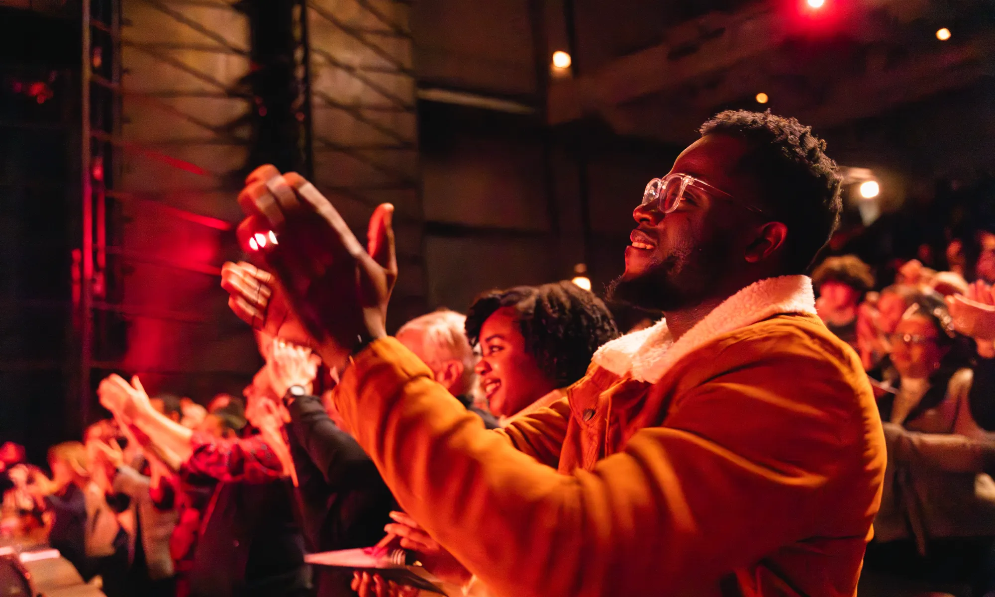 The audience at the Harris giving a performance a standing ovation.