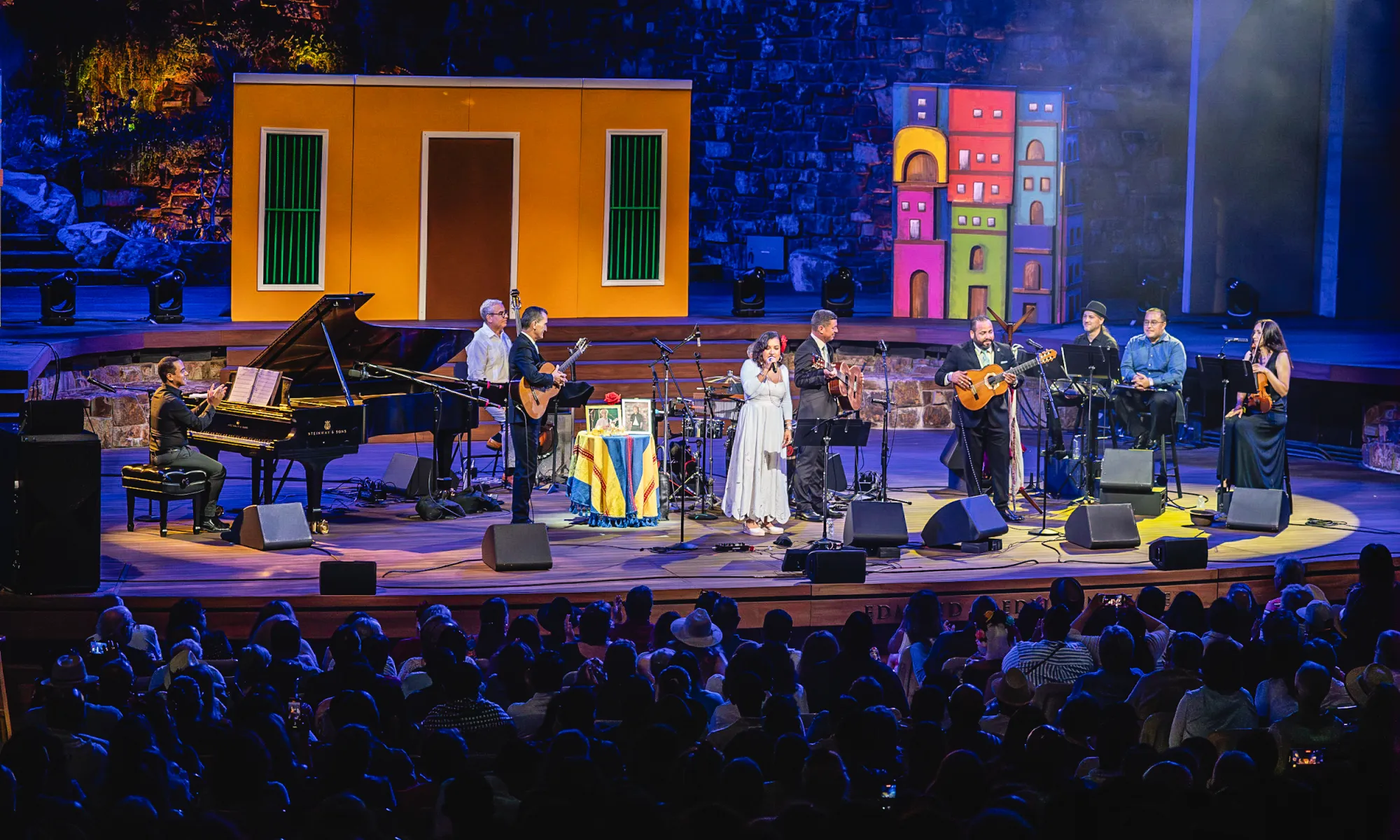 An ensemble performing on stage.