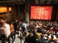 People finding seats inside the theater