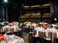 Picture of a seated dinner onstage.
