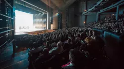 A packed Harris Theater audience