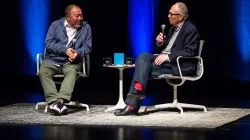 Image of Ai Weiwei and Ian Baruma in conversation on the Harris Theater stage. 