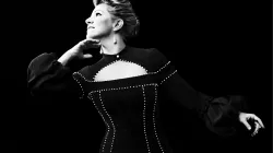 Joyce DiDonato in black dress with black background