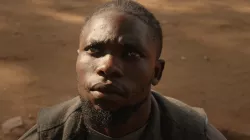 A person looking up at the sky while their eyes lit up