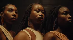 Three African American female dancers facing the same direction
