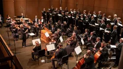 Dame Jane Glover with Music of the Baroque's chorus and orchestra