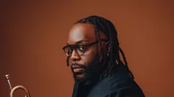 Marquis Hill holding a trumpet