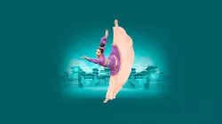 A dancer in a traditional purple and beige garment extends her leg up in the air while extending one arm out in front of her and the other up. She is placed in front a green Chinese temple.