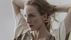 Image of Wendy Whelan with her arms behind her neck. 