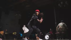 A dancer on stage performing. 