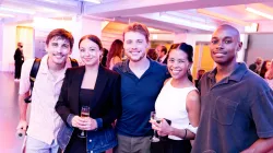 A group of young people get pose together for the photo.