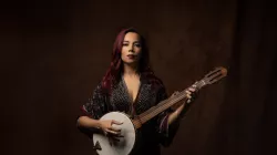 Rhiannon Giddens holding a Bango. 