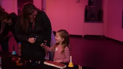 Girl smiling with a rattle 