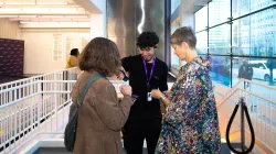 An audience service representative scanning a patron's ticket. 