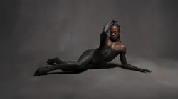 A dancer laying on the floor