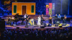 An ensemble performing on stage.