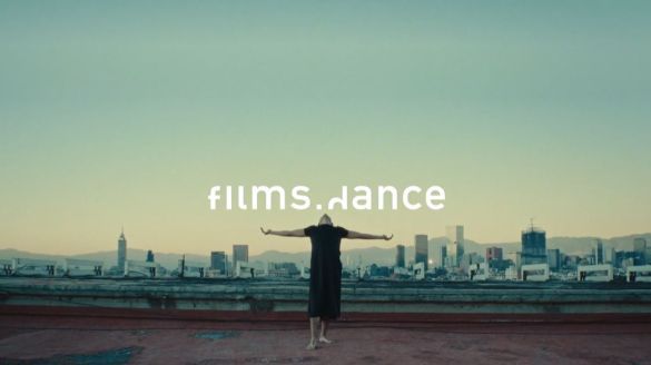 films.dance. Dancer dressed in black extending their arms out.