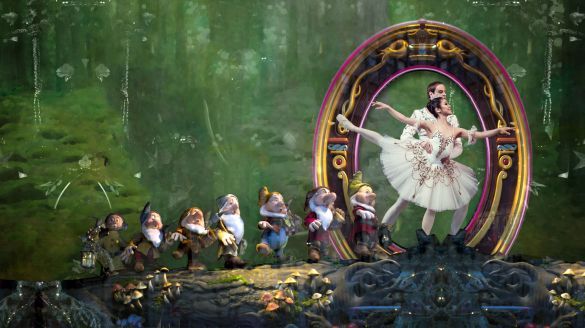 Snow White, dressed in a flowing gown, dances gracefully with the prince amidst a forest backdrop, surrounded by seven charming dwarfs.