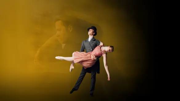 Dancer dressed as Edgar Allan Poe with top hat holds dying ballerina arm down with coral dress.