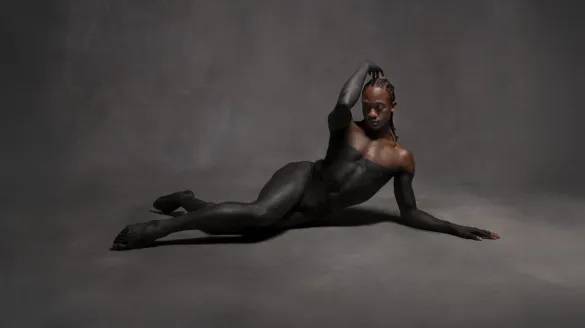 A dancer laying on the floor