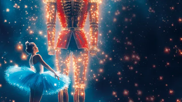 A ballerina facing a large Nutcracker