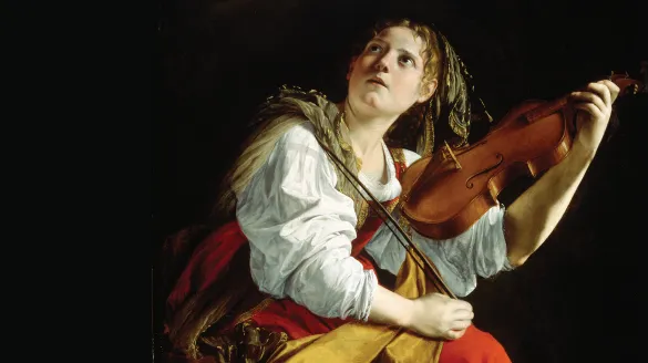 a woman holding a violin