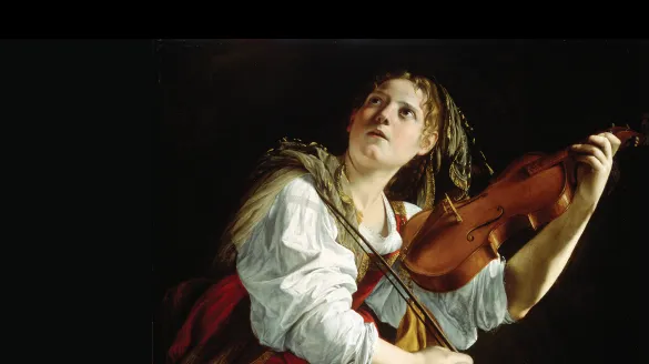 a woman holding a violin