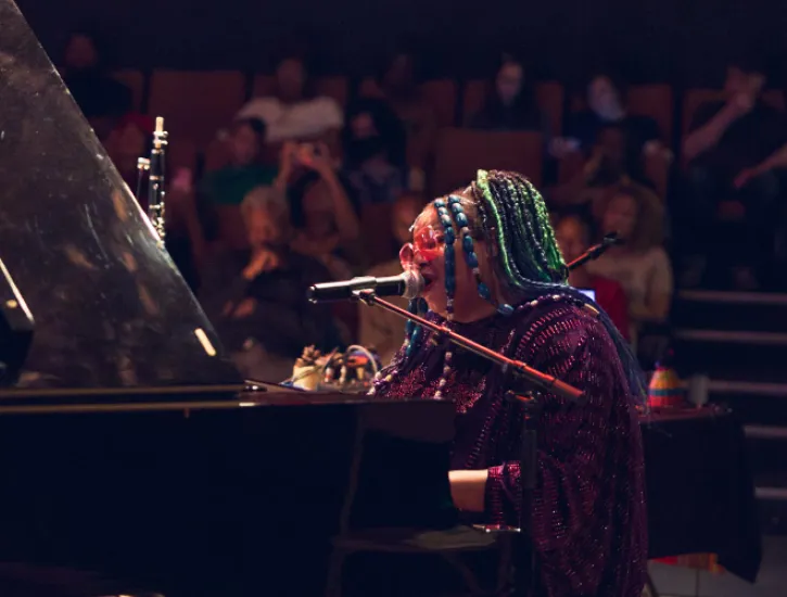 Angel Bad Dawid playing the piano.