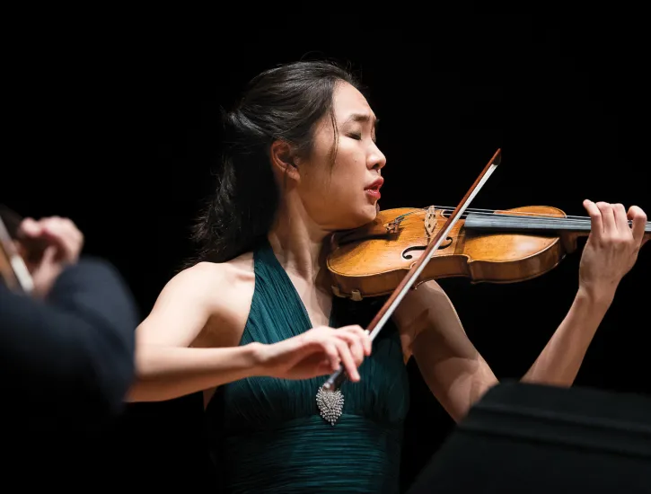 A woman playing the violin. 