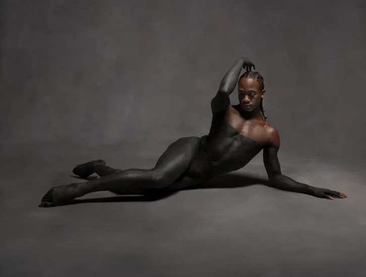 A dancer laying on the floor