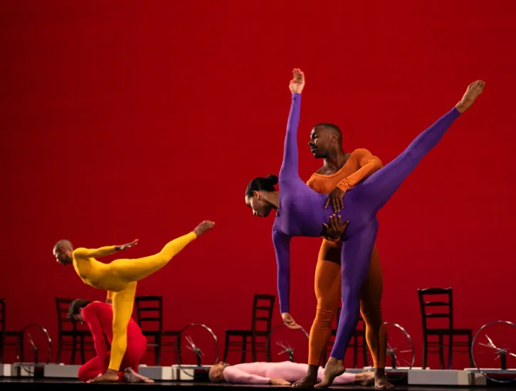 Dancers in colorful leotards.